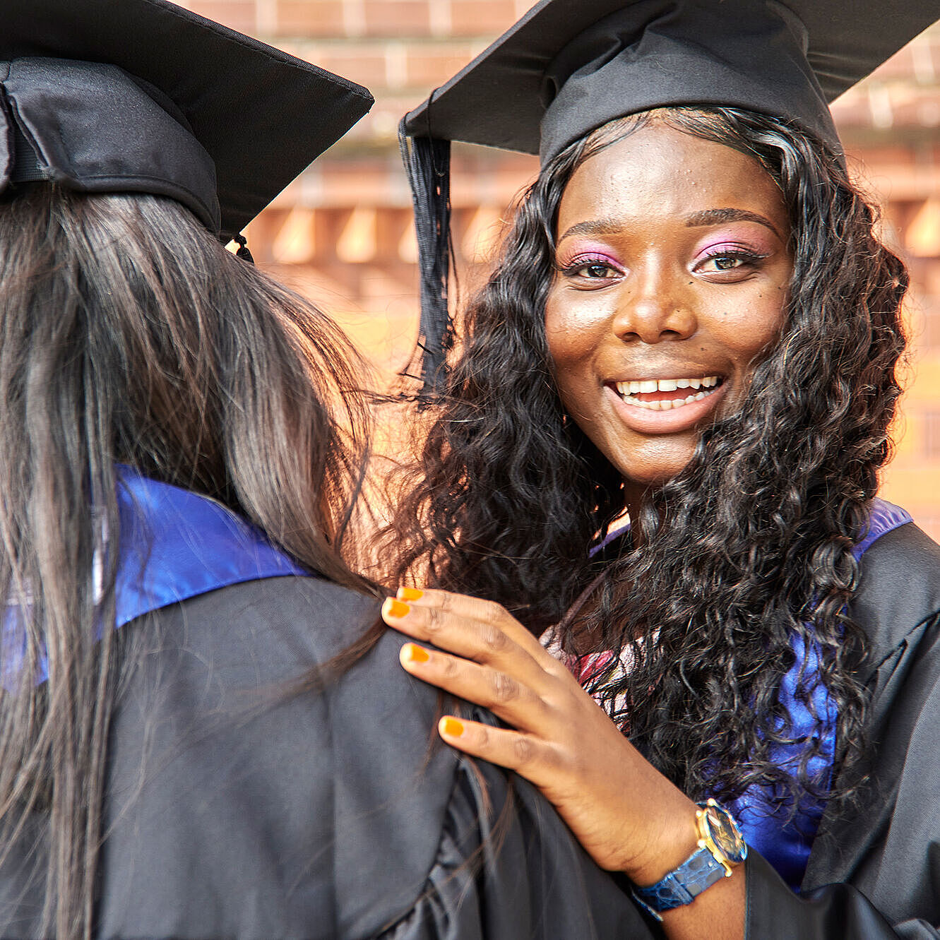 African student in gown on graduation day